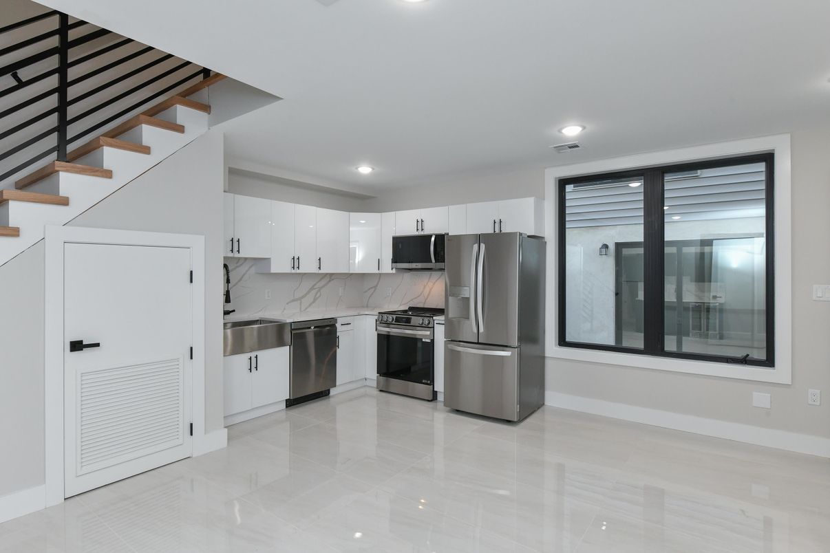 Interior, Kitchen, Marble Walls, Recessed Lighting, Stainless Steel Appliances