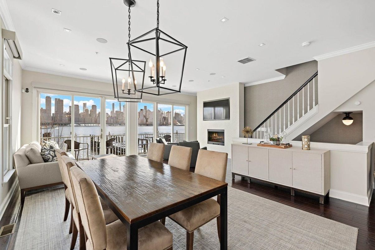 Dining room, Fireplace, Interior, Living room, Pendant Lights, Recessed Lighting, Water, Wood Texture Flooring