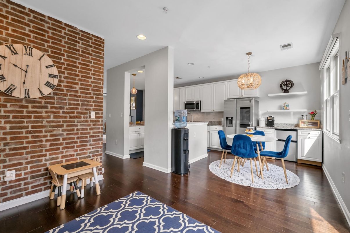 Chandelier, Dining room, Interior, Kitchen, Pendant Lights, Recessed Lighting, Stainless Steel Appliances, Stone Walls, Wood Texture Flooring