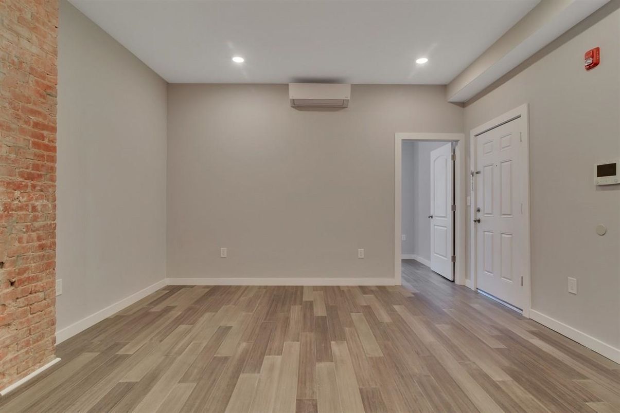 Empty room, Interior, Recessed Lighting, Stone Walls, Wood Texture Flooring