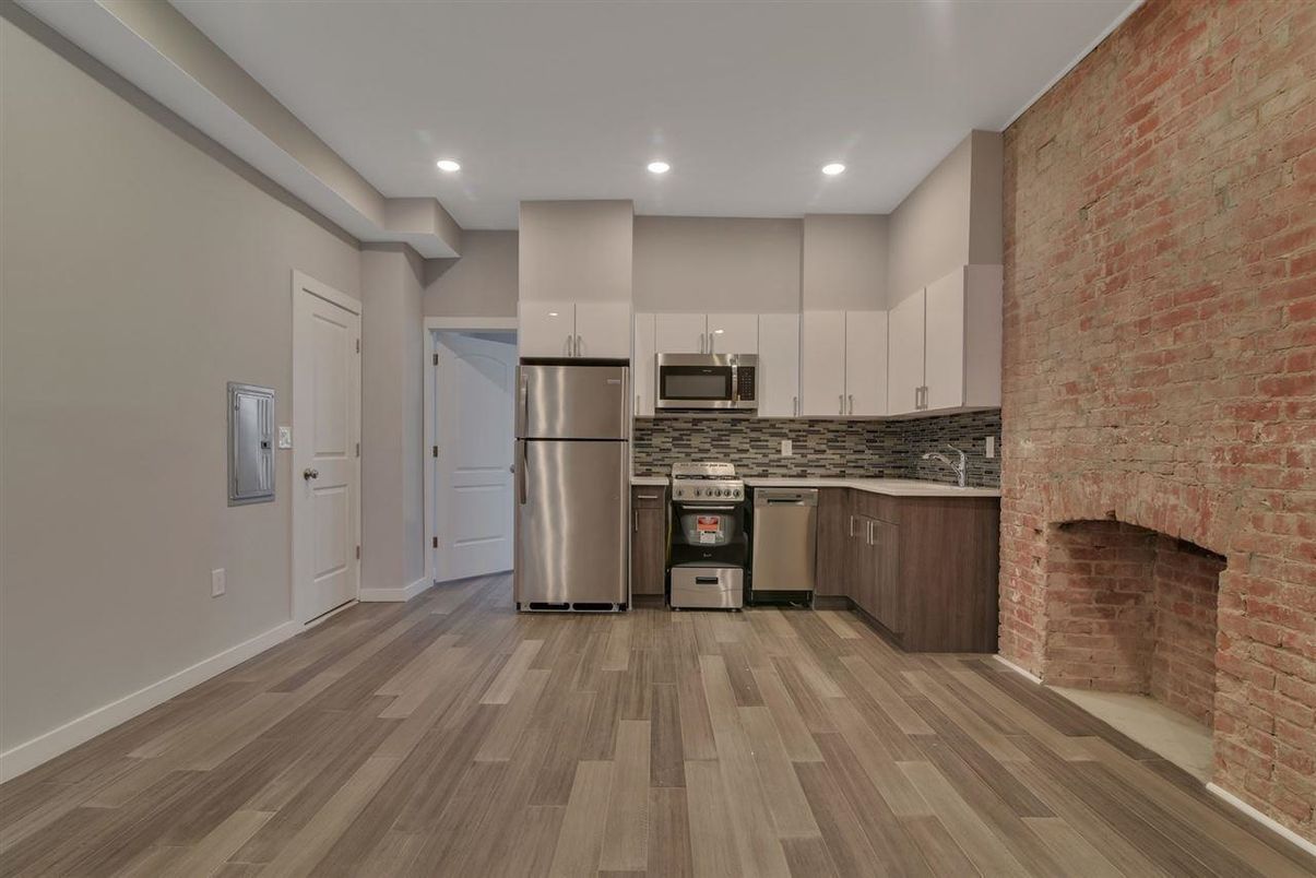 Interior, Kitchen, Recessed Lighting, Stainless Steel Appliances, Stone Walls, Wood Texture Flooring