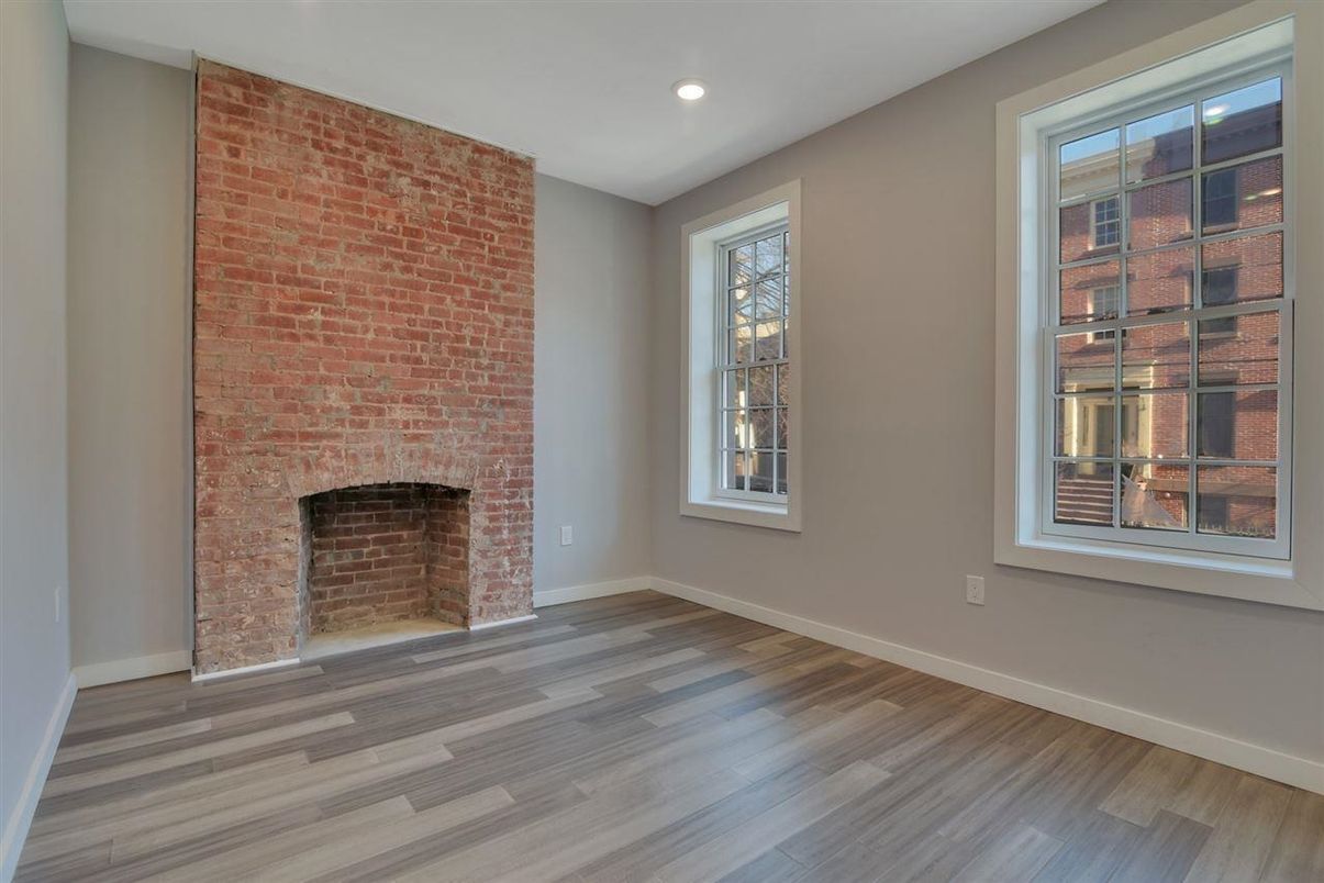 Empty room, Fireplace, Interior, Recessed Lighting, Stone Walls, Wood Texture Flooring