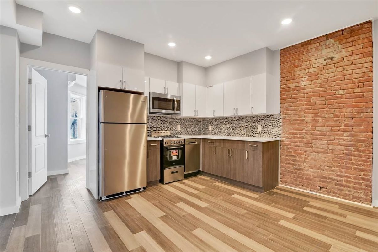 Interior, Kitchen, Recessed Lighting, Stainless Steel Appliances, Stone Walls, Wood Texture Flooring