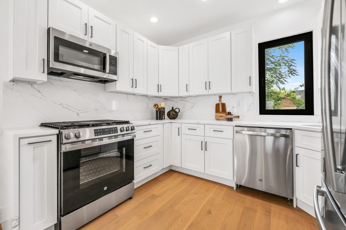Interior, Kitchen, Marble Walls, Recessed Lighting, Stainless Steel Appliances, Wood Texture Flooring