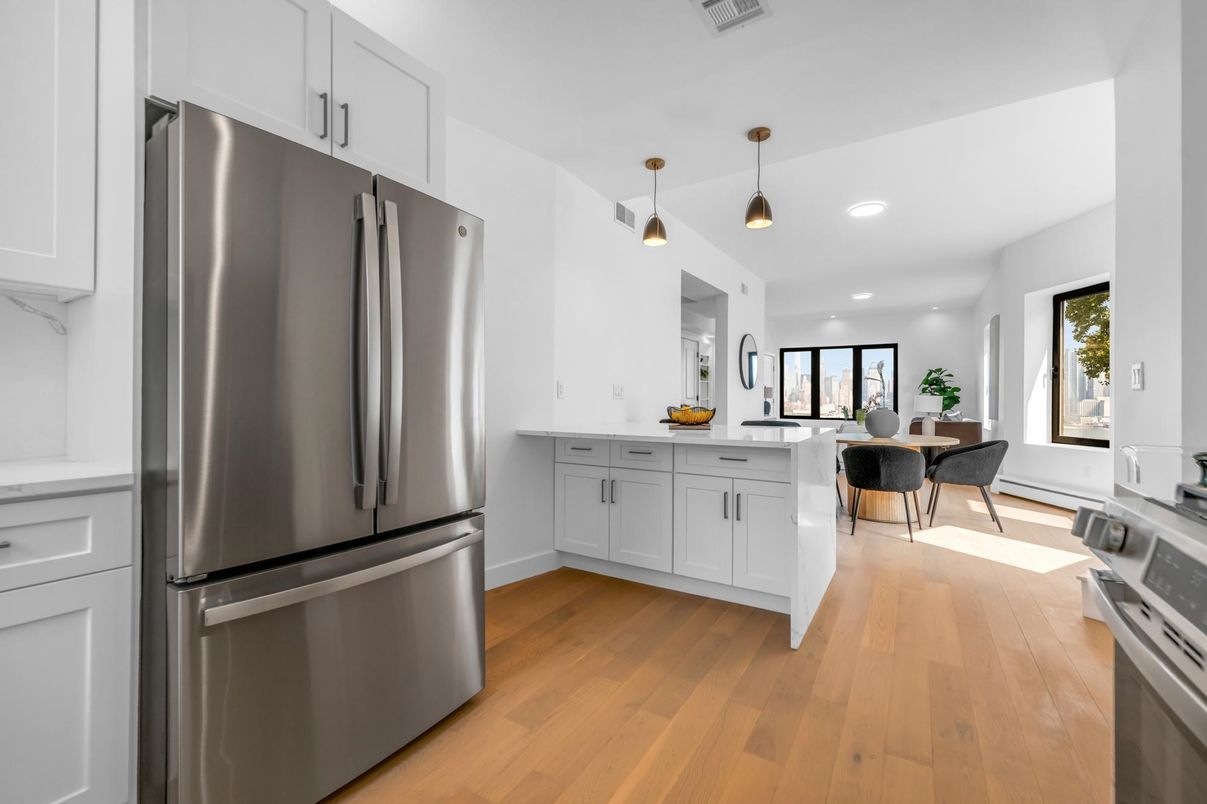 Dining room, Interior, Kitchen, Pendant Lights, Recessed Lighting, Stainless Steel Appliances, Wood Texture Flooring