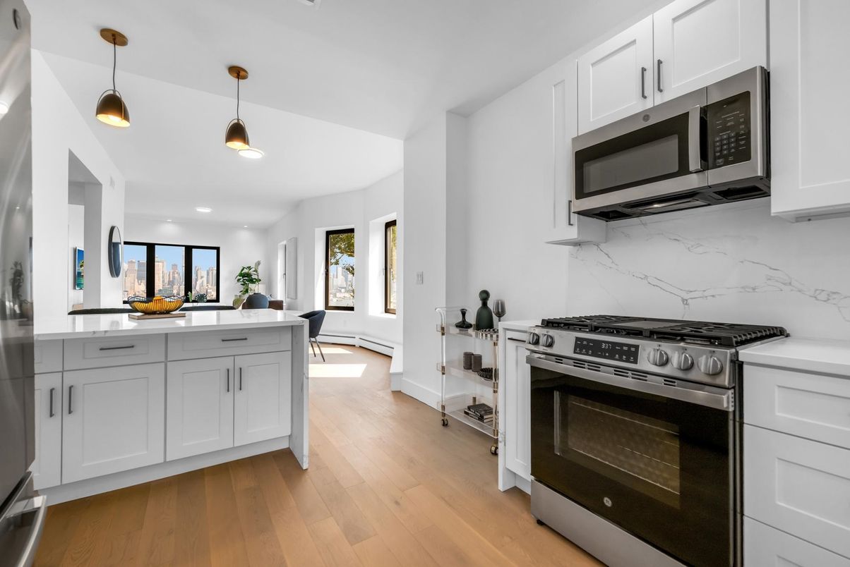 Interior, Kitchen, Marble Walls, Pendant Lights, Stainless Steel Appliances, Wood Texture Flooring
