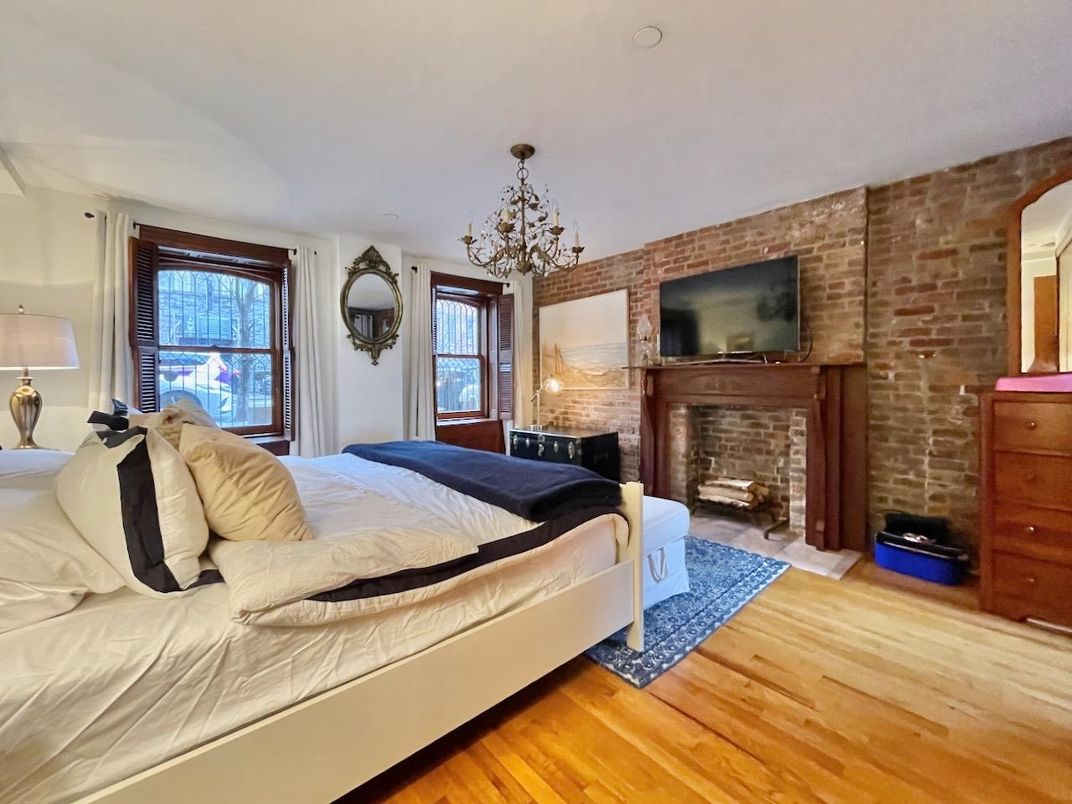 Bedroom, Chandelier, Fireplace, Interior, Stone Walls, Wood Texture Flooring