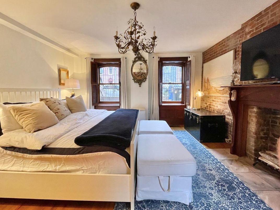 Bedroom, Chandelier, Fireplace, Interior, Stone Walls, Wood Texture Flooring