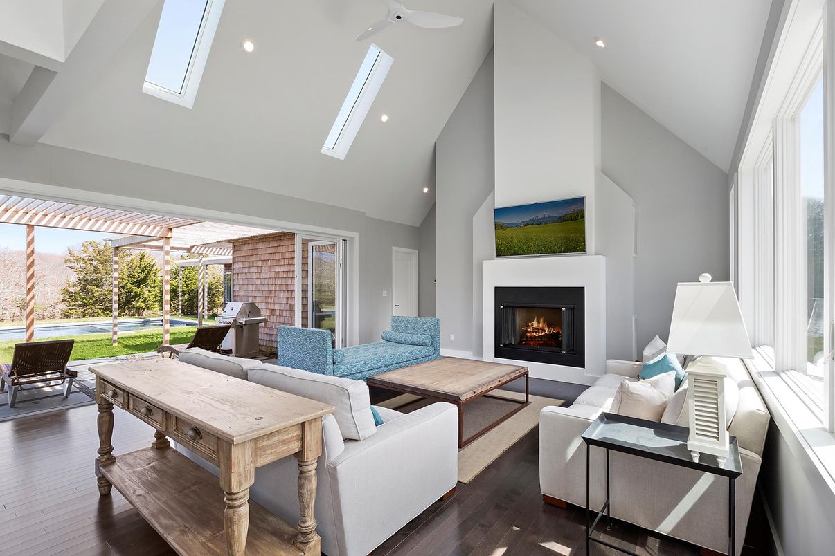 Fireplace, Interior, Living room, Recessed Lighting, Stone Walls, Wood Texture Flooring
