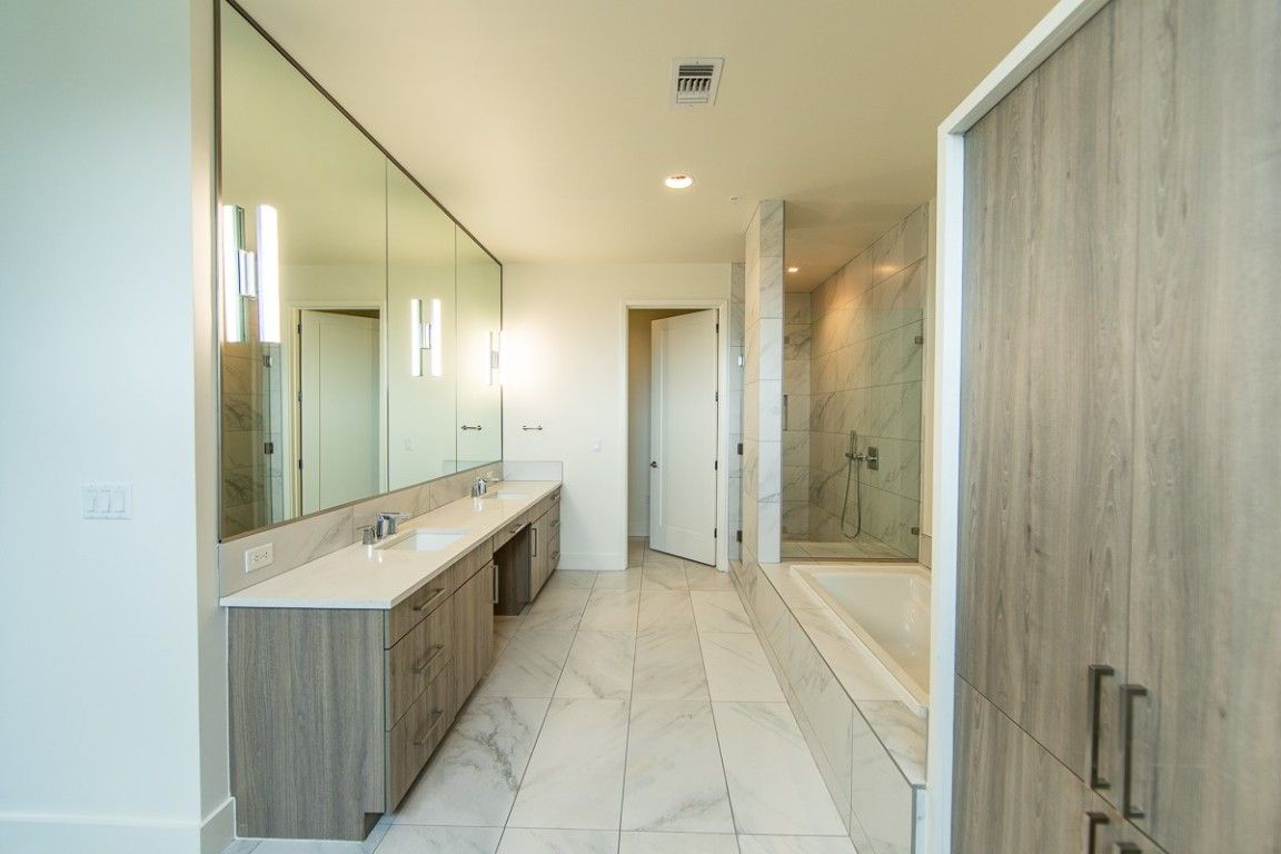Bathroom, Dual Sink Vanities, Glass Shower, Interior, Marble, Marble Walls, Recessed Lighting