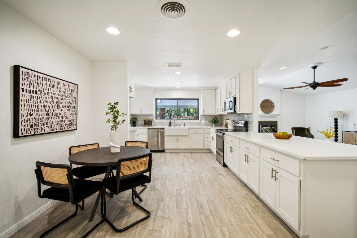 Dining room, Interior, Kitchen, Recessed Lighting, Stainless Steel Appliances, Wood Texture Flooring