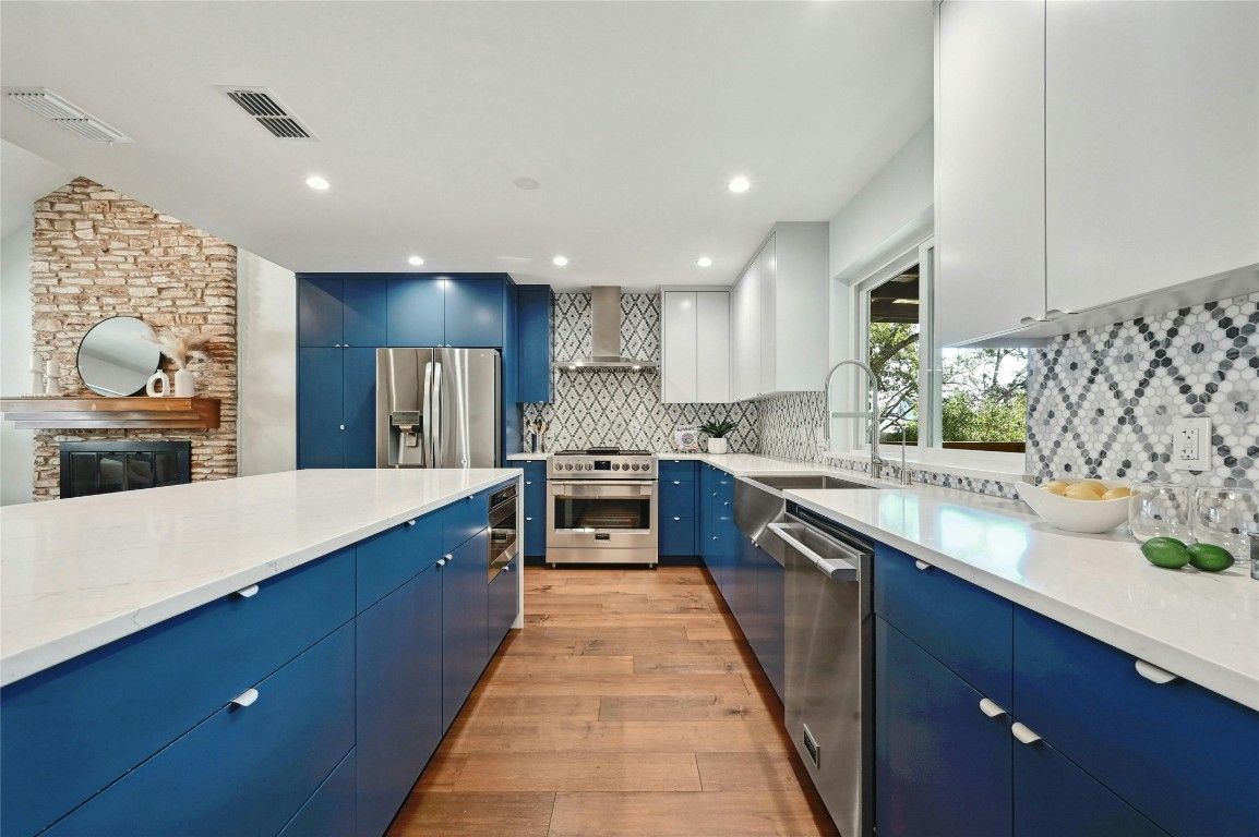 Fireplace, Interior, Kitchen, Recessed Lighting, Stainless Steel Appliances, Stone Walls, Wood Texture Flooring