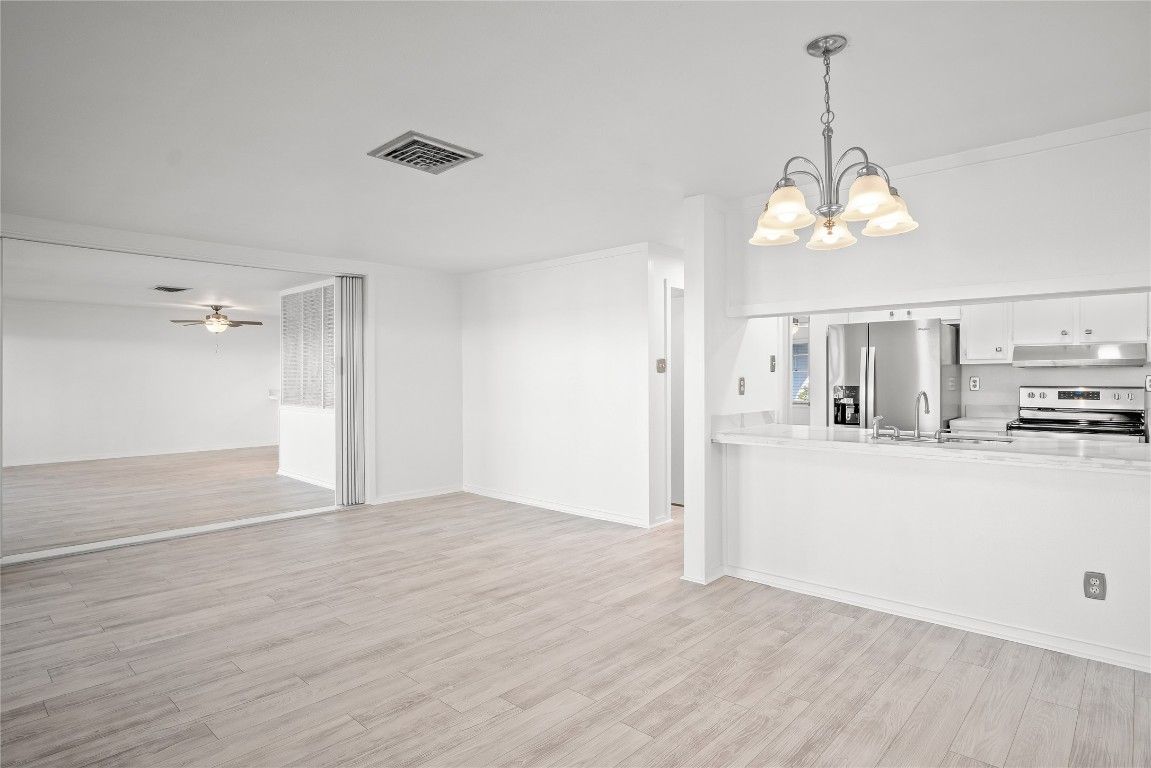 Chandelier, Empty room, Interior, Kitchen, Stainless Steel Appliances, Wood Texture Flooring