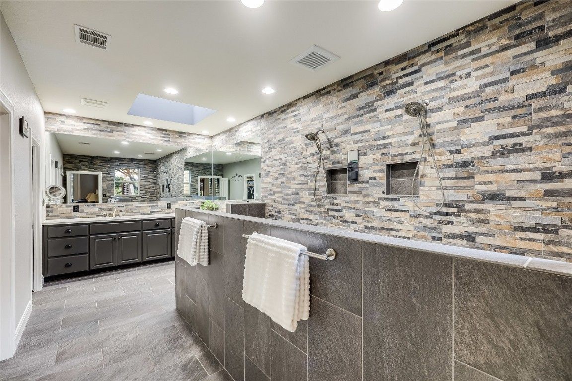 Bathroom, Dual Sink Vanities, Interior, Recessed Lighting, Stone Walls