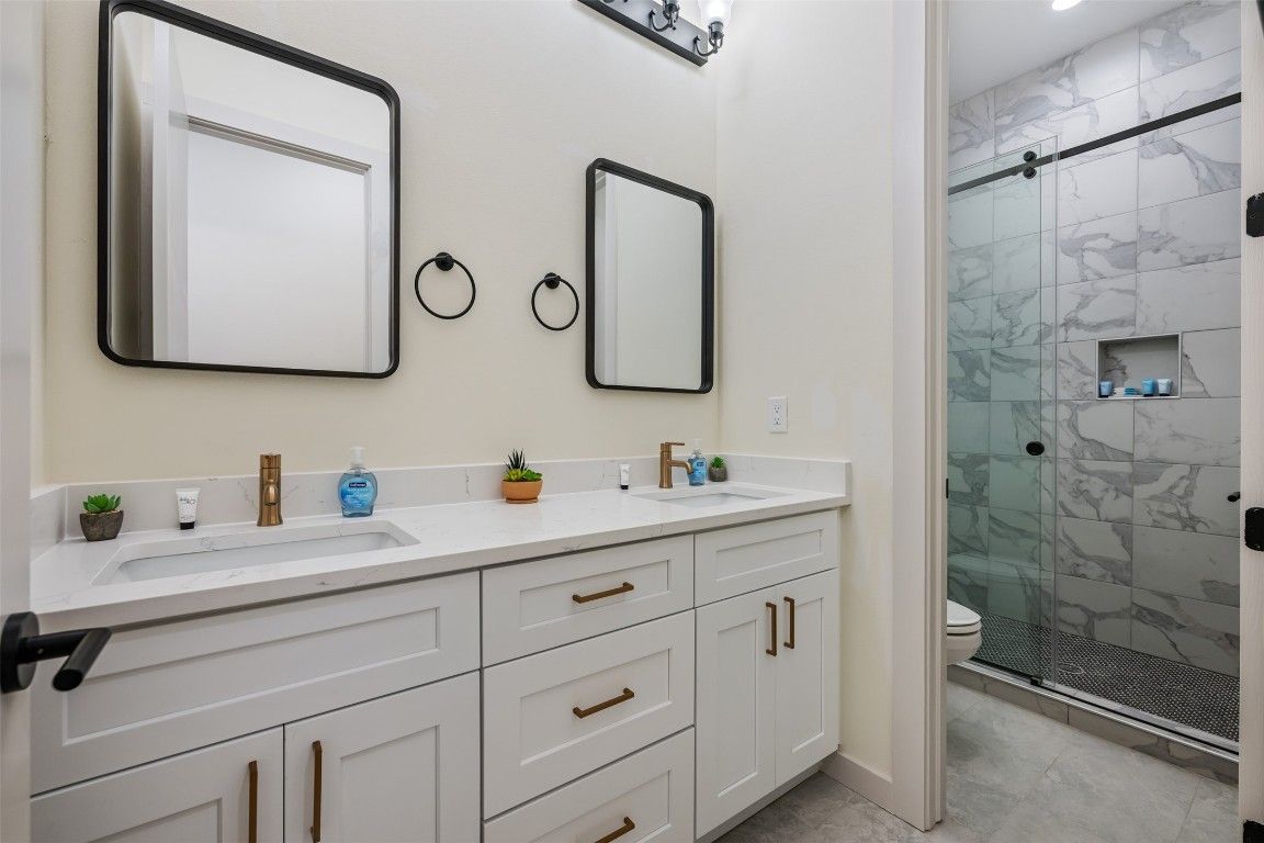 Bathroom, Dual Sink Vanities, Glass Shower, Interior, Marble Walls, Recessed Lighting