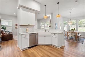 Dining room, Interior, Kitchen, Living room, Pendant Lights, Recessed Lighting, Stainless Steel Appliances, Wood Texture Flooring