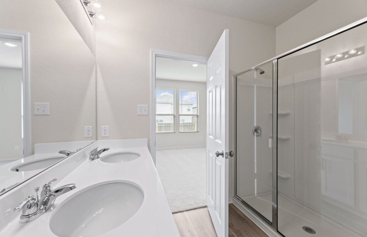 Bathroom, Dual Sink Vanities, Glass Shower, Interior, Recessed Lighting, Wood Texture Flooring