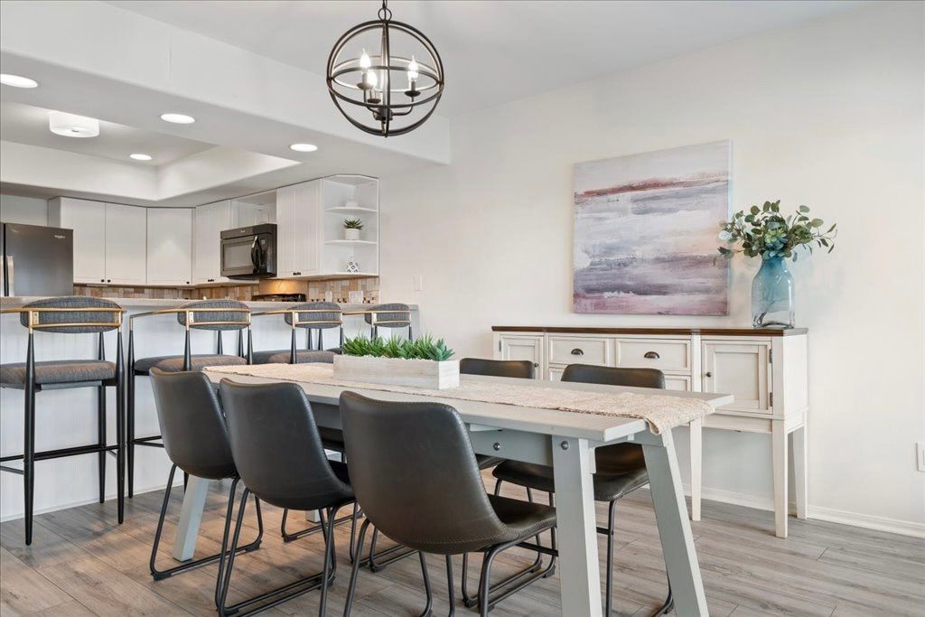 Dining room, Interior, Kitchen, Pendant Lights, Recessed Lighting, Stainless Steel Appliances, Wood Texture Flooring