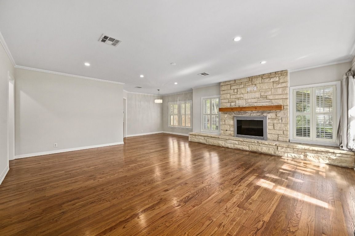 Empty room, Fireplace, Interior, Pendant Lights, Recessed Lighting, Stone Walls, Wood Texture Flooring