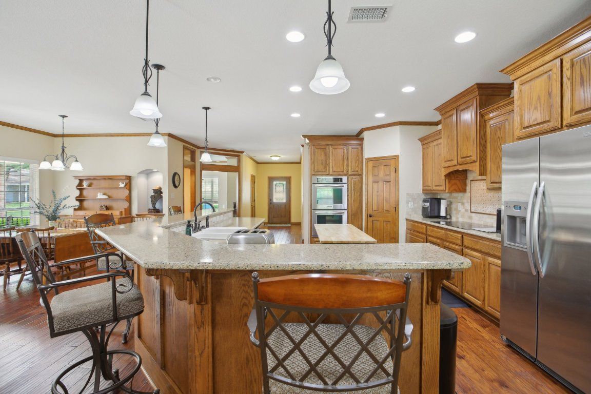 Dining room, Interior, Kitchen, Pendant Lights, Recessed Lighting, Stainless Steel Appliances, Wood Texture Flooring
