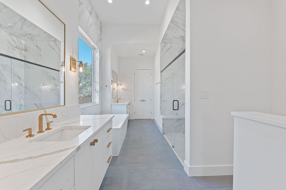 Bathroom, Dual Sink Vanities, Glass Shower, Interior, Marble Walls, Recessed Lighting