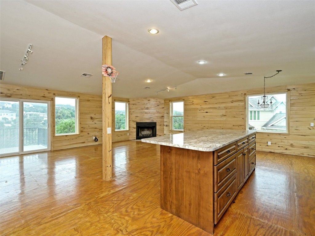Chandelier, Empty room, Fireplace, Interior, Recessed Lighting, Wood Texture Flooring, Wooden Walls