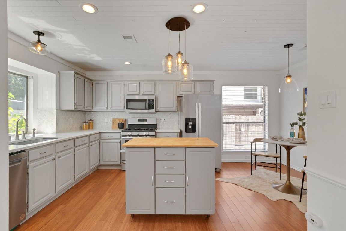 Interior, Kitchen, Pendant Lights, Recessed Lighting, Stainless Steel Appliances, Wood Texture Flooring