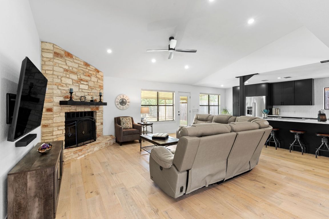 Fireplace, Interior, Kitchen, Living room, Recessed Lighting, Stainless Steel Appliances, Stone Walls, Wood Texture Flooring