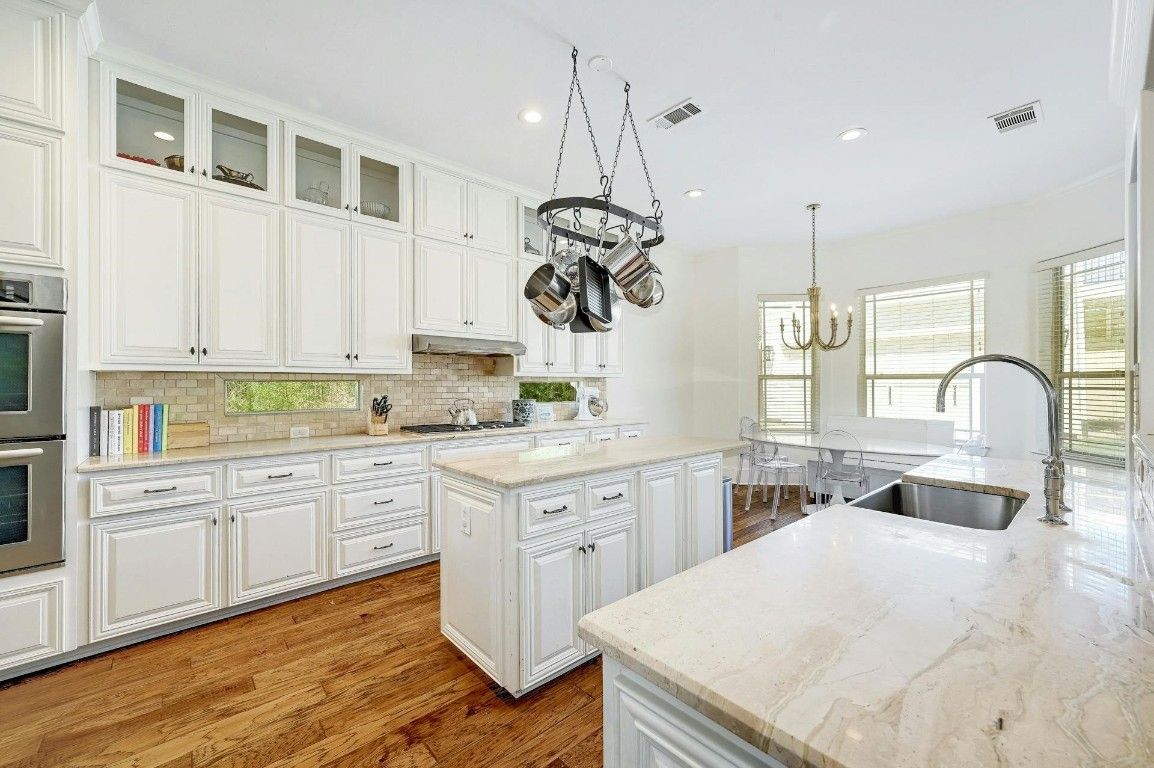 Chandelier, Interior, Kitchen, Pendant Lights, Recessed Lighting, Stainless Steel Appliances, Wood Texture Flooring