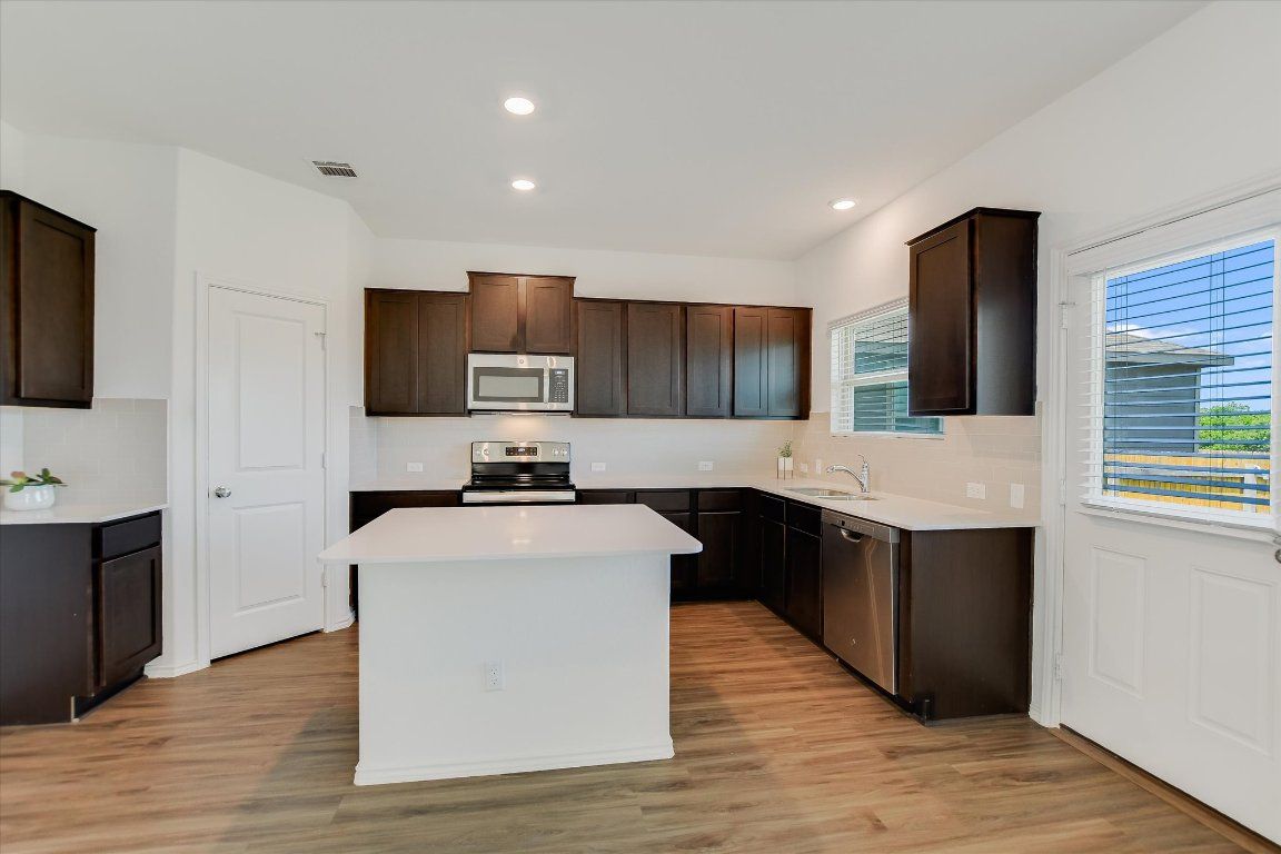 Interior, Kitchen, Recessed Lighting, Stainless Steel Appliances, Wood Texture Flooring