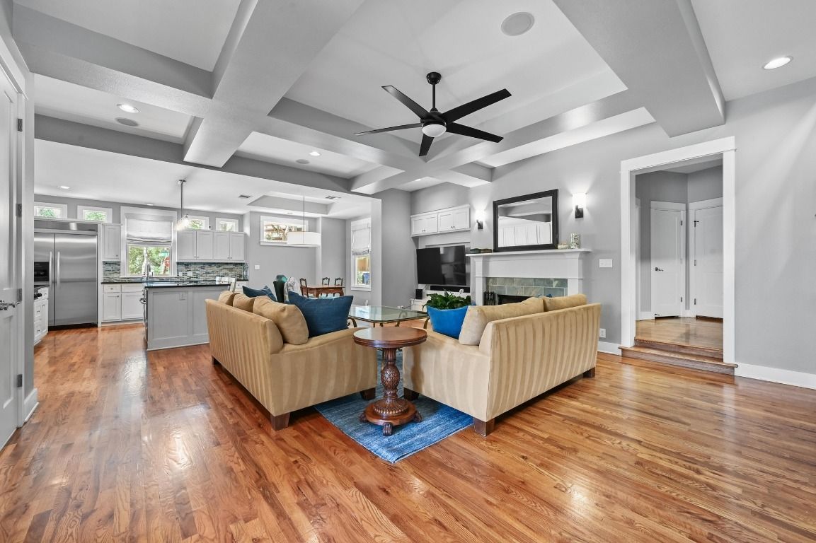 Fireplace, Interior, Kitchen, Living room, Pendant Lights, Recessed Lighting, Stainless Steel Appliances, Wood Texture Flooring