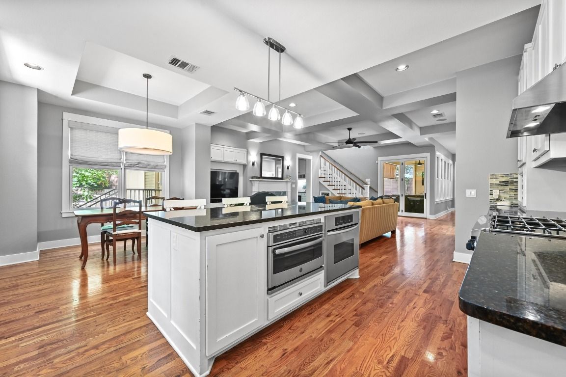 Dining room, Interior, Kitchen, Pendant Lights, Recessed Lighting, Stainless Steel Appliances, Wood Texture Flooring