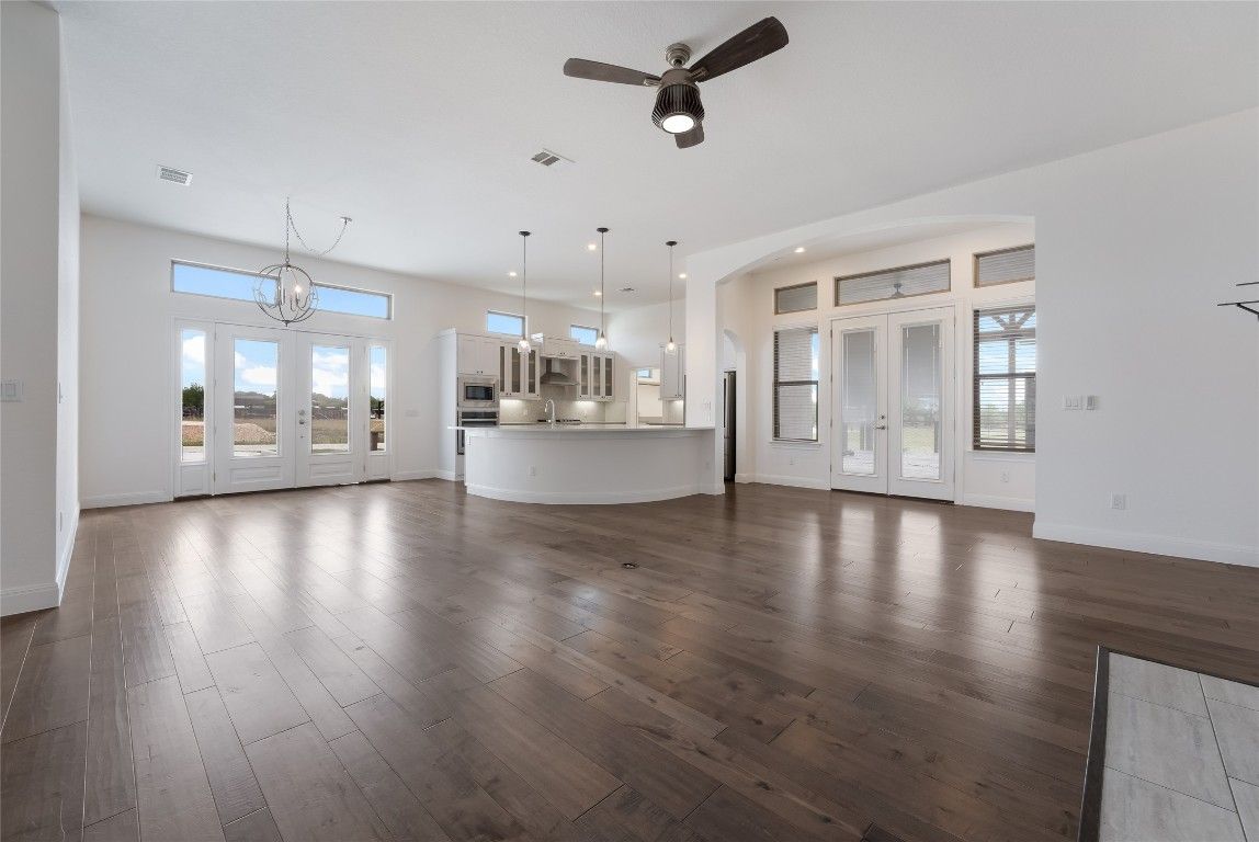 Chandelier, Empty room, Interior, Kitchen, Pendant Lights, Recessed Lighting, Stainless Steel Appliances, Wood Texture Flooring