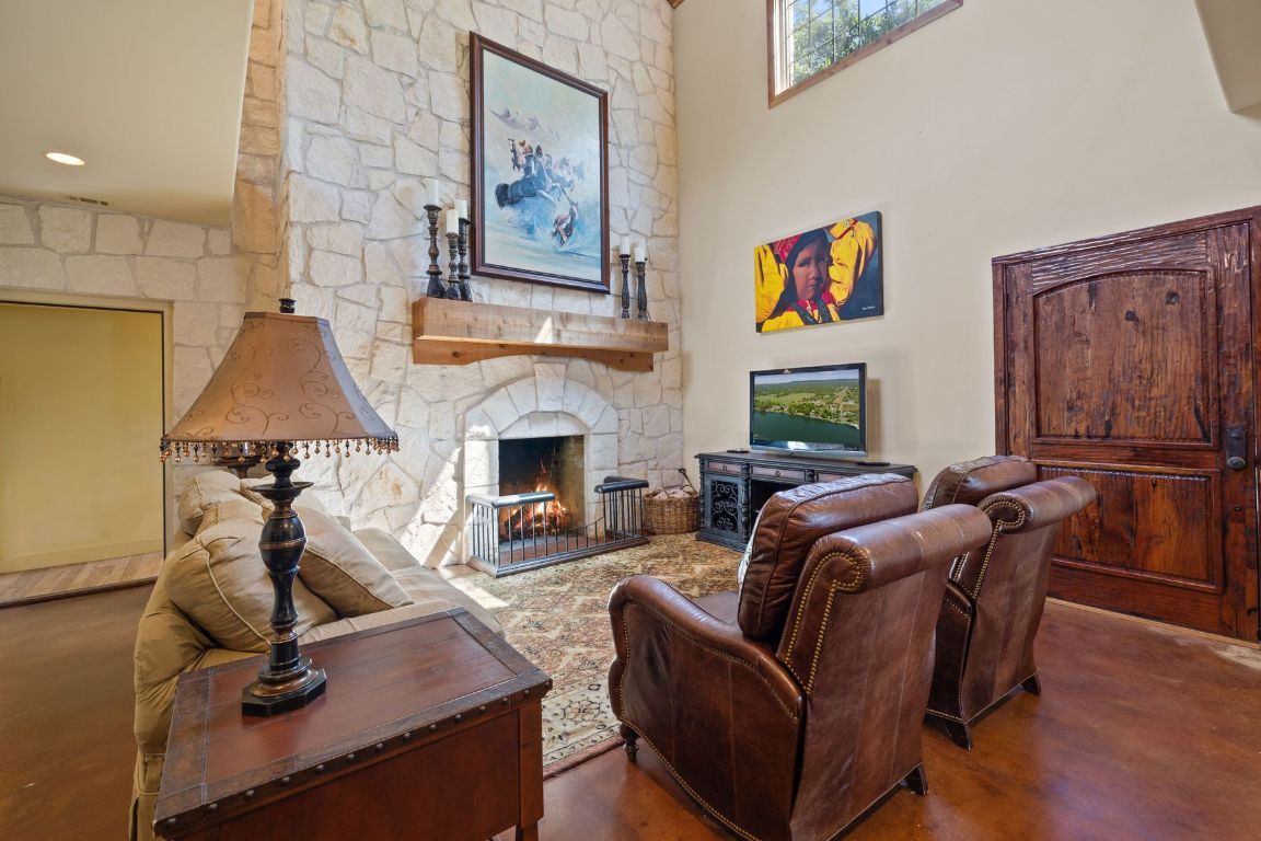 Fireplace, Interior, Living room, Recessed Lighting, Stone Walls, Wood Texture Flooring