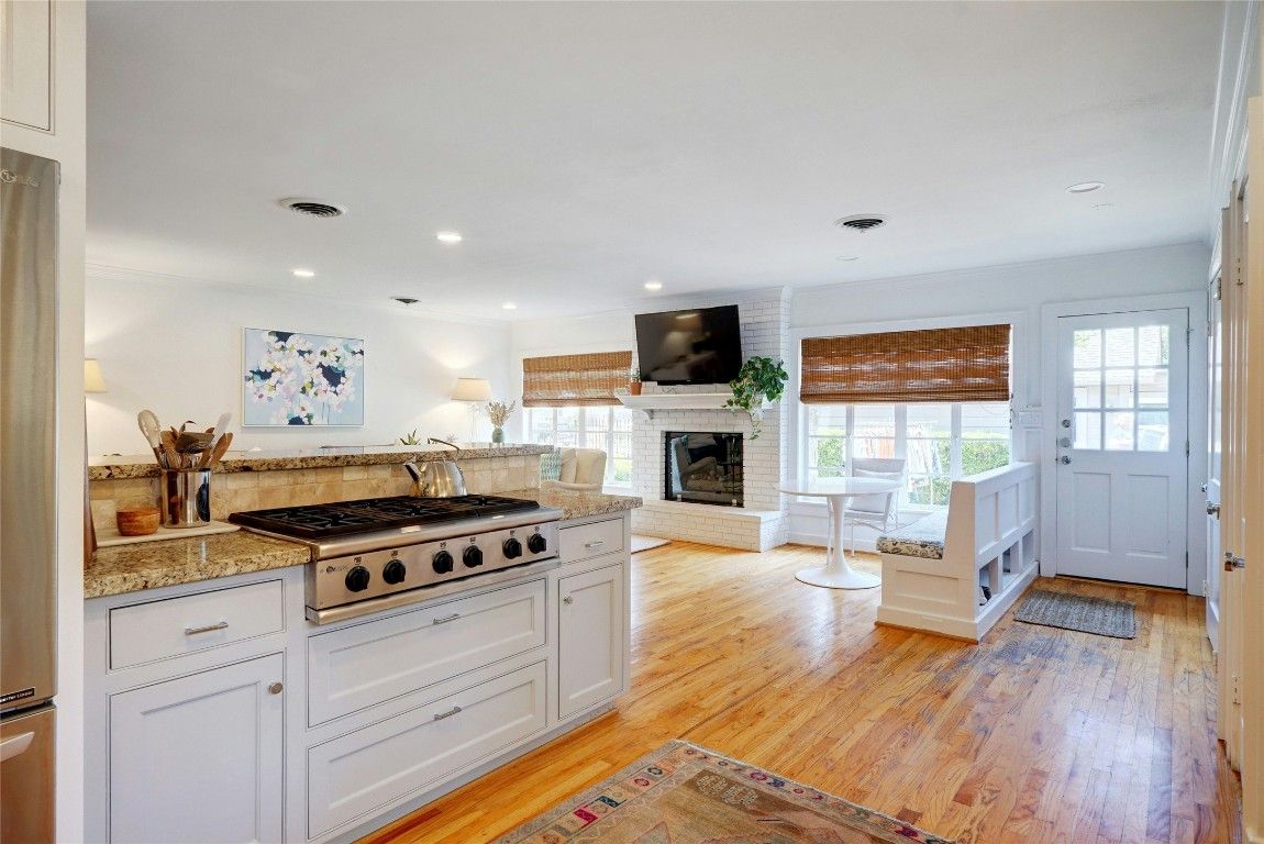 Fireplace, Interior, Kitchen, Recessed Lighting, Stainless Steel Appliances, Wood Texture Flooring