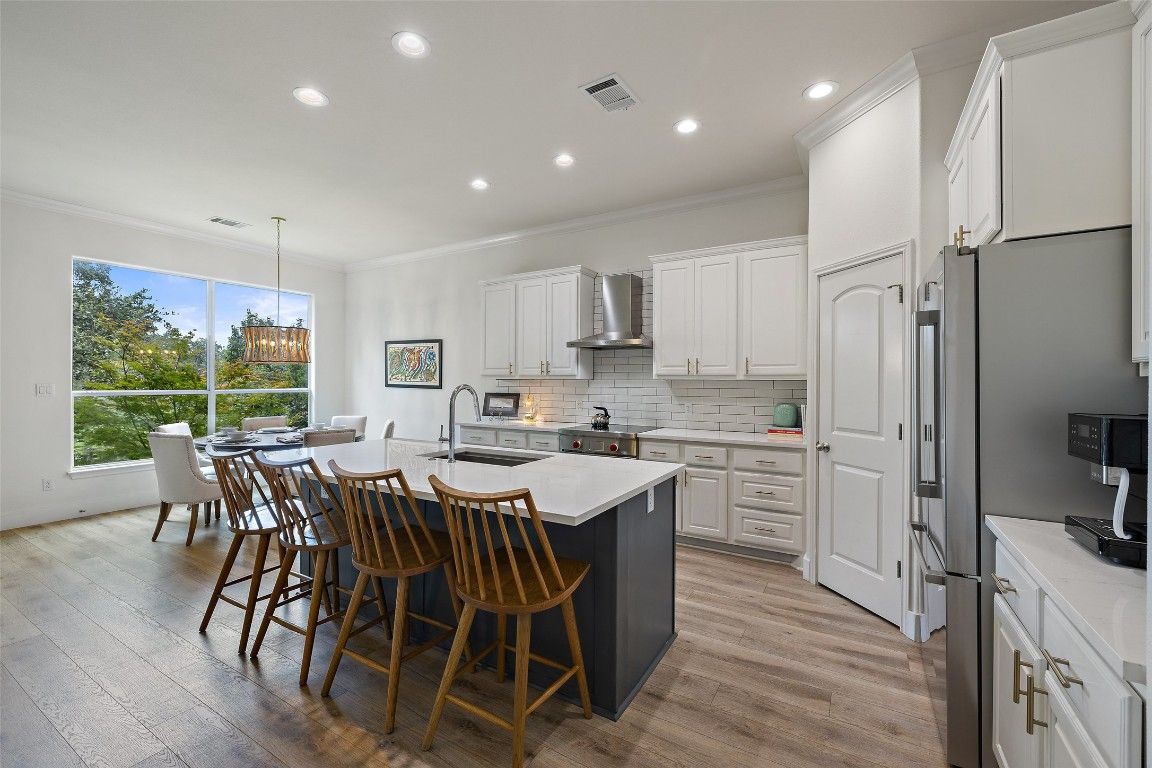 Dining room, Interior, Kitchen, Pendant Lights, Recessed Lighting, Stainless Steel Appliances, Wood Texture Flooring