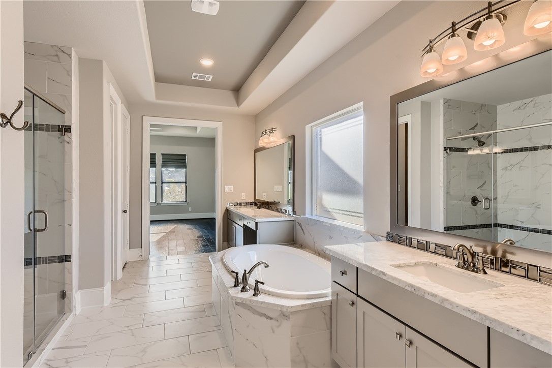 Bathroom, Dual Sink Vanities, Glass Shower, Interior, Marble, Marble Walls, Recessed Lighting