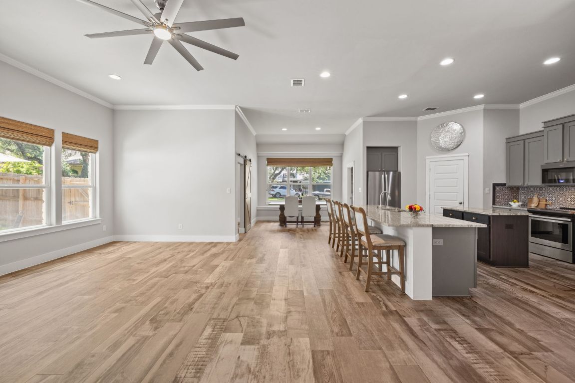 Dining room, Interior, Kitchen, Recessed Lighting, Stainless Steel Appliances, Wood Texture Flooring