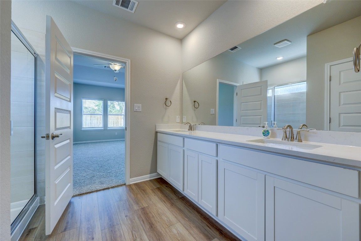 Bathroom, Dual Sink Vanities, Interior, Recessed Lighting, Wood Texture Flooring