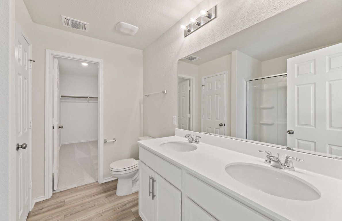 Bathroom, Dual Sink Vanities, Glass Shower, Interior, Recessed Lighting, Wood Texture Flooring