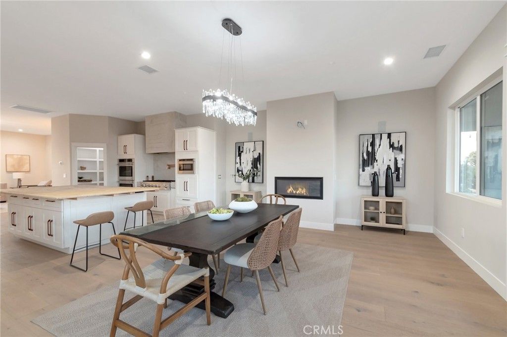 Chandelier, Dining room, Fireplace, Interior, Kitchen, Pendant Lights, Recessed Lighting, Wood Texture Flooring