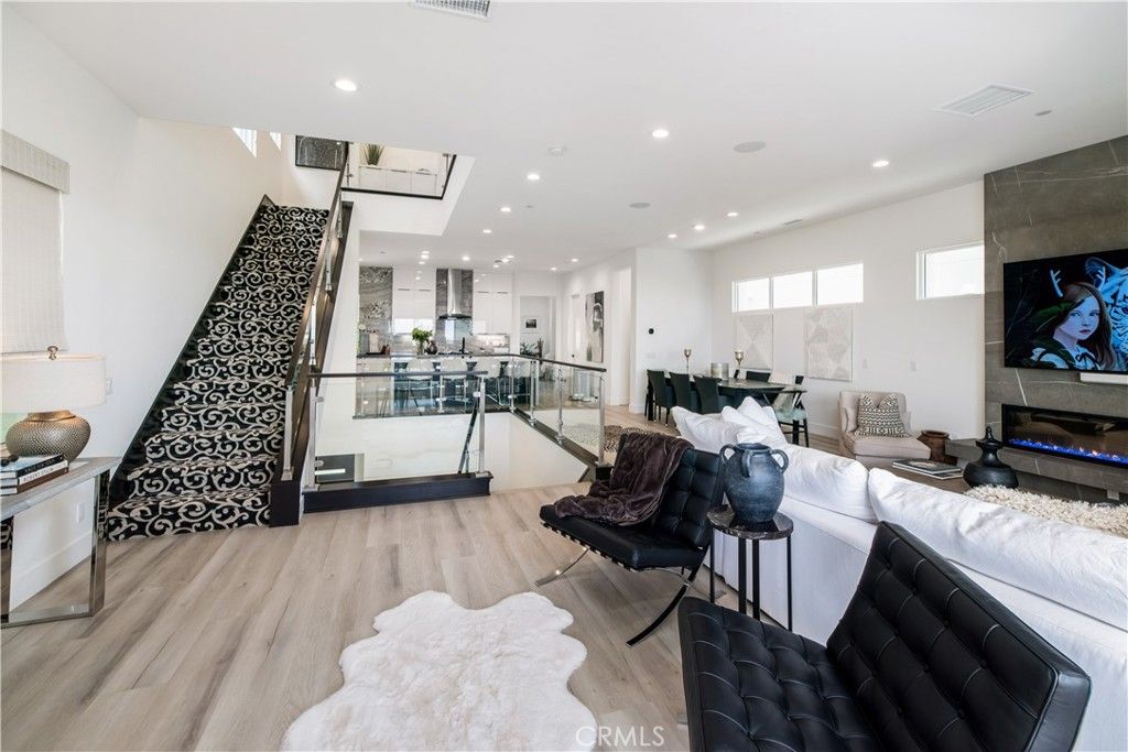 Dining room, Interior, Kitchen, Living room, Recessed Lighting, Stainless Steel Appliances, Wood Texture Flooring