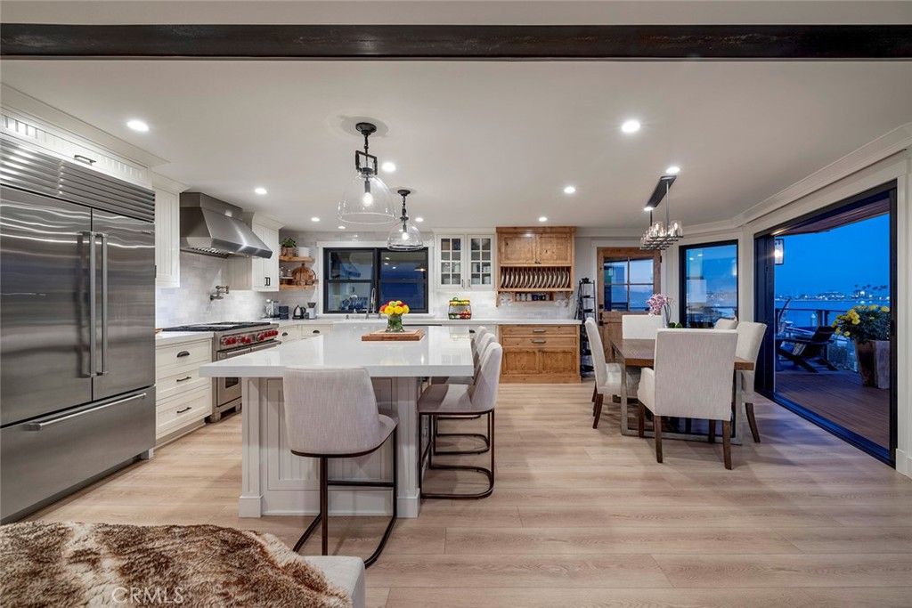 Chandelier, Dining room, Interior, Kitchen, Pendant Lights, Recessed Lighting, Stainless Steel Appliances, Wood Texture Flooring