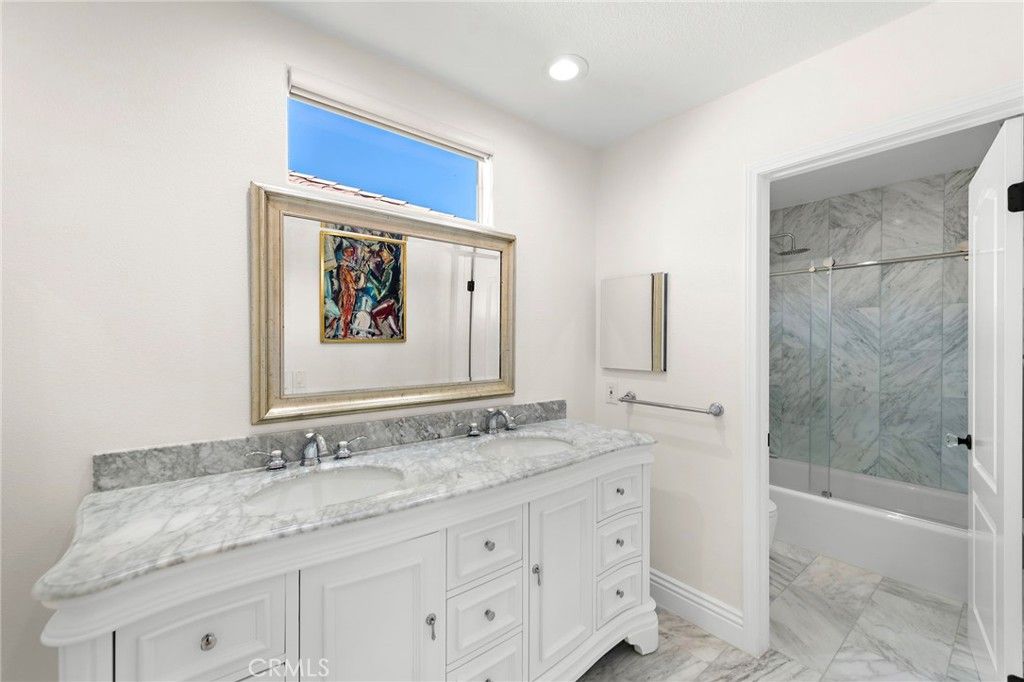 Bathroom, Dual Sink Vanities, Glass Shower, Interior, Marble, Marble Walls, Recessed Lighting