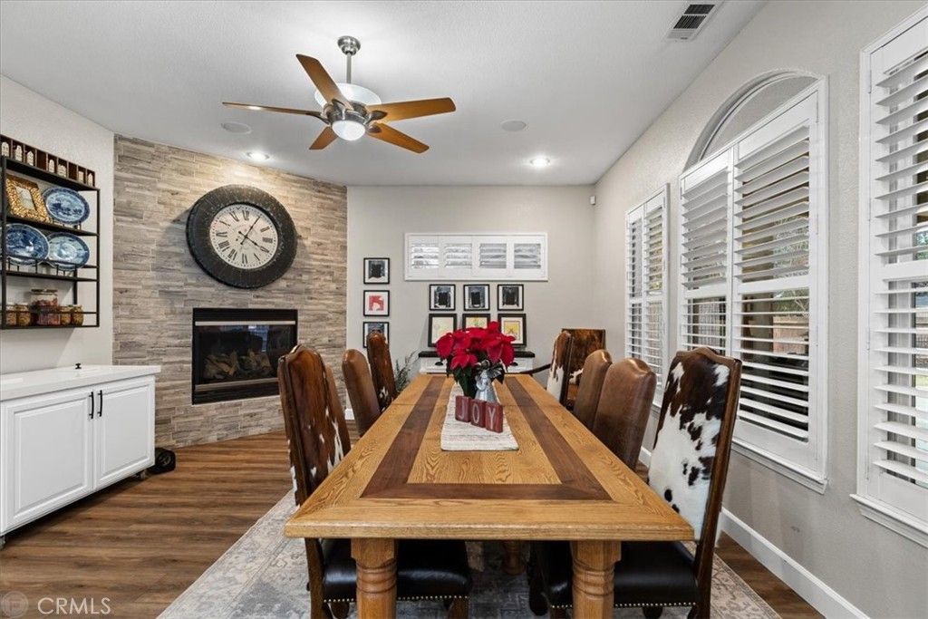 Dining room, Fireplace, Interior, Recessed Lighting, Stone Walls, Wood Texture Flooring
