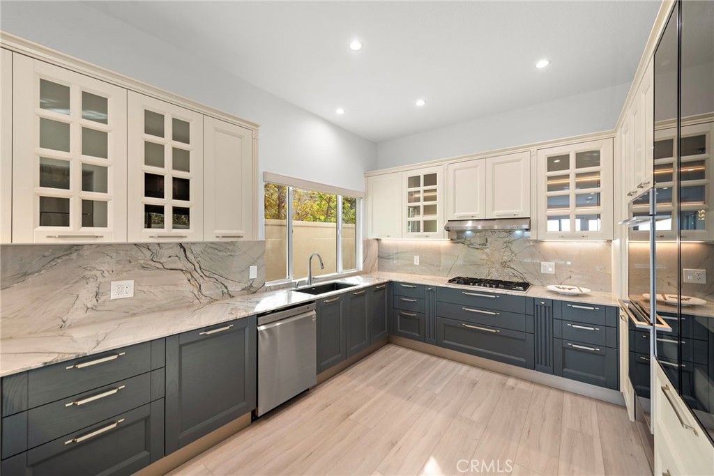 Interior, Kitchen, Marble Walls, Recessed Lighting, Stainless Steel Appliances, Wood Texture Flooring