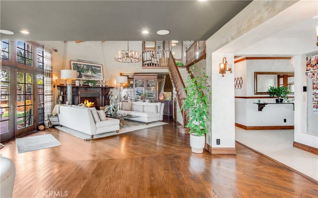 Chandelier, Fireplace, Interior, Living room, Recessed Lighting, Wood Texture Flooring