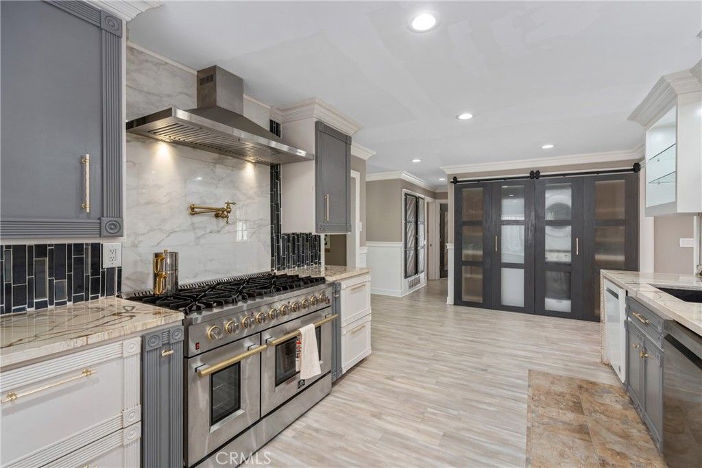 Interior, Kitchen, Marble Walls, Recessed Lighting, Stainless Steel Appliances, Wood Texture Flooring