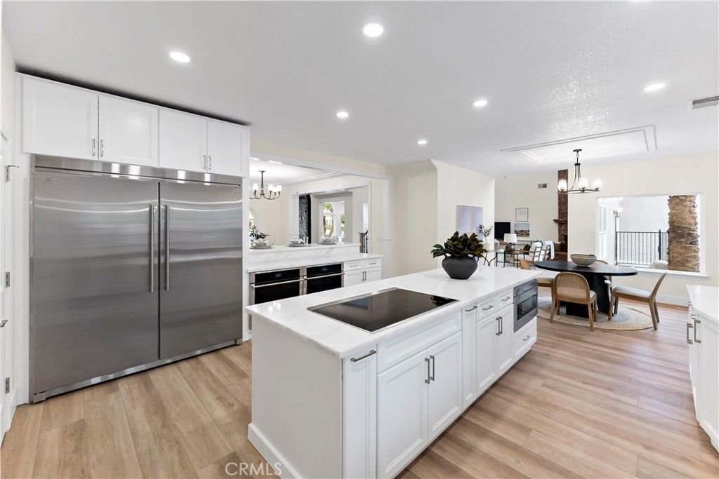 Chandelier, Dining room, Interior, Kitchen, Recessed Lighting, Stainless Steel Appliances, Wood Texture Flooring