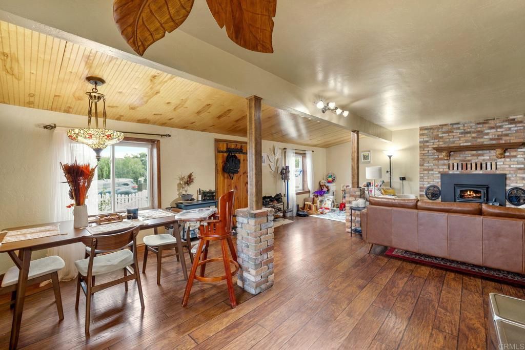Dining room, Fireplace, Interior, Living room, Stone Walls, Wooden Ceilings, Wood Texture Flooring